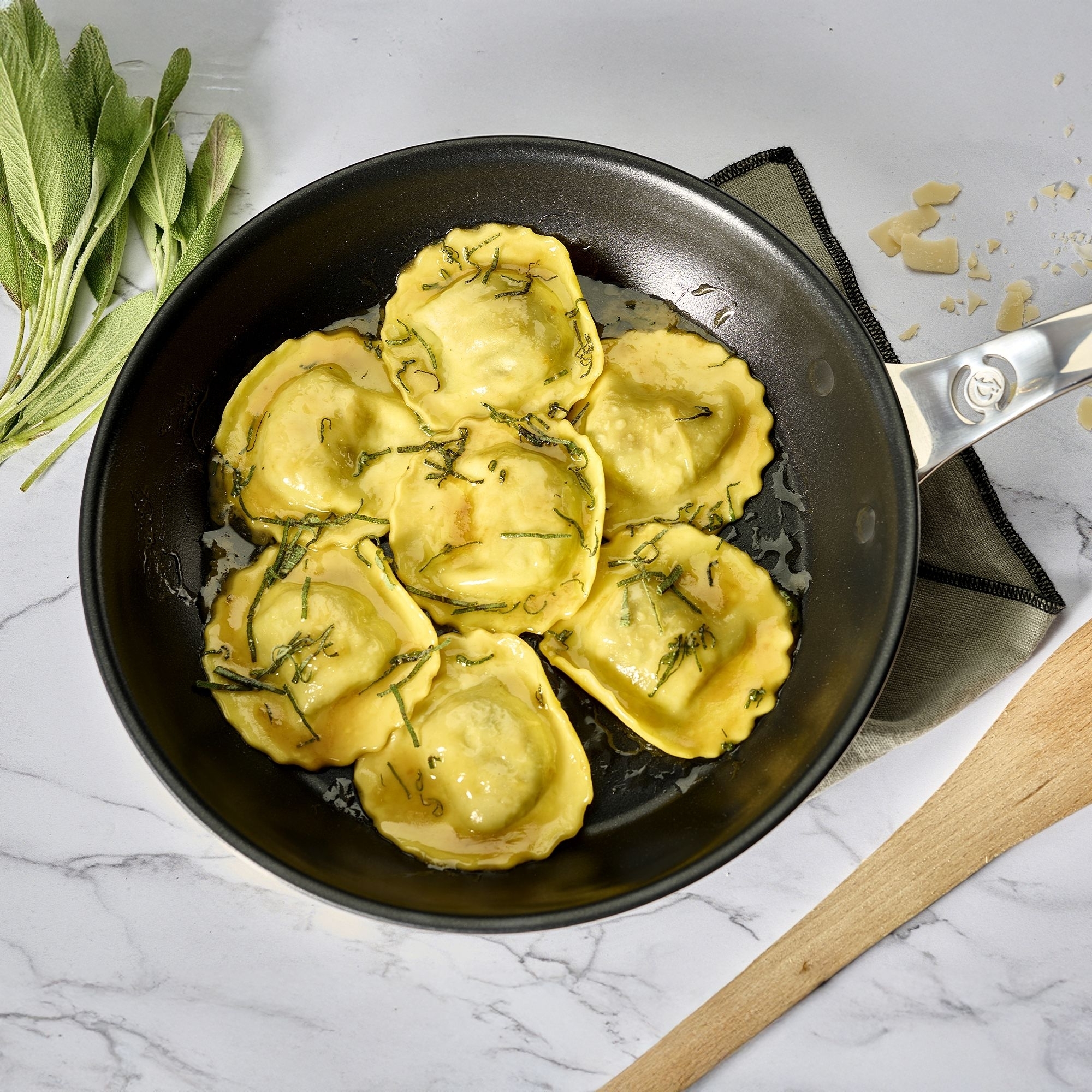 Fresh ravioli in butter sage sauce in pan
