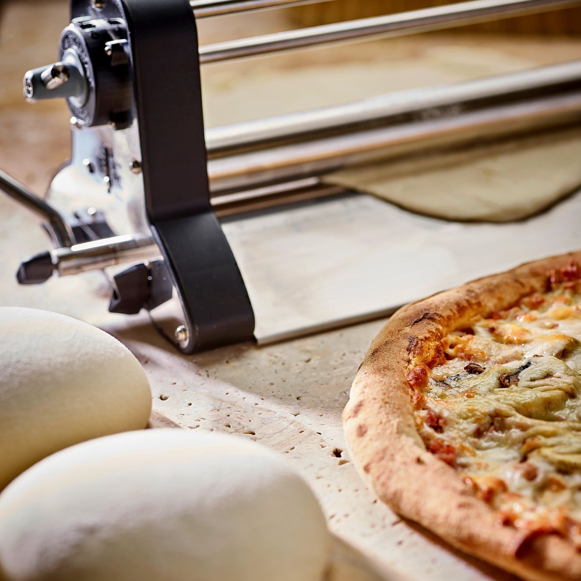 Pizza and pizza dough with dough roller